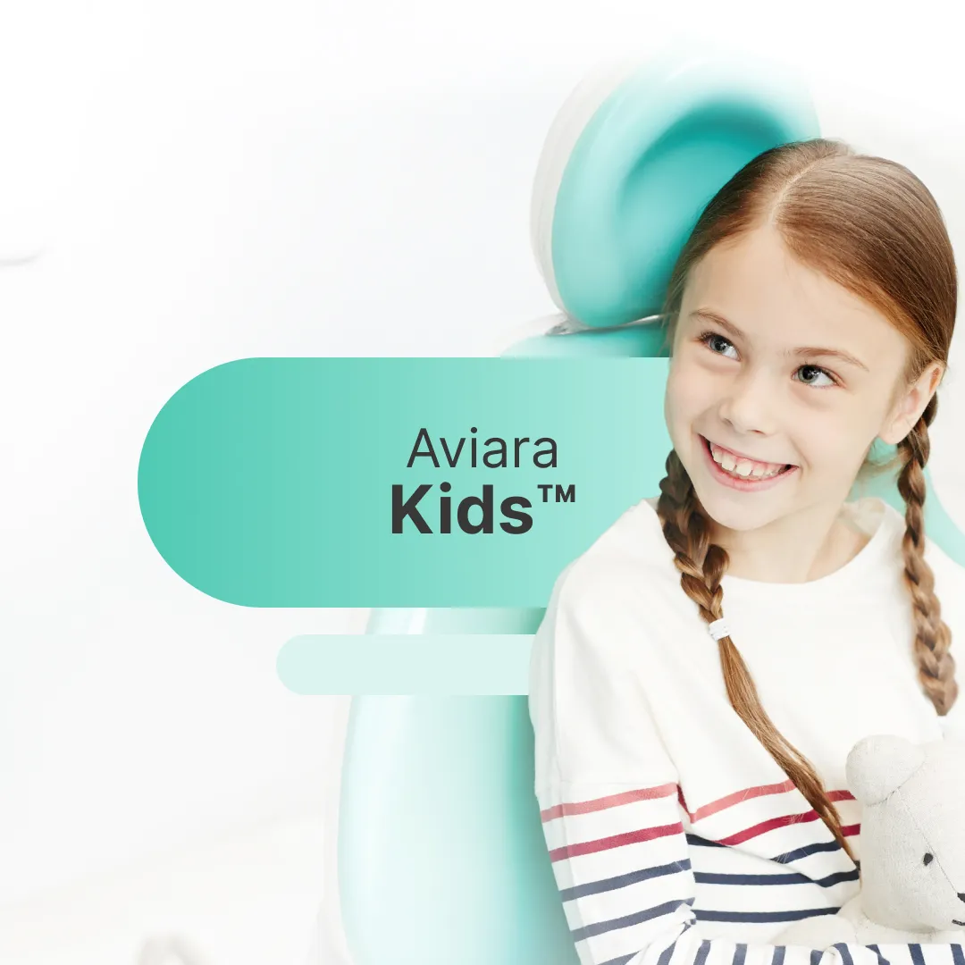 Happy girl in dentist chair, pediatric dentistry