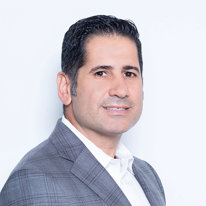 Professional photograph of Dr. Jean-Pierre Khreich in business suit in studio