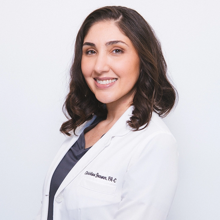 Professional photograph of Bill Harnold in lab coat in studio