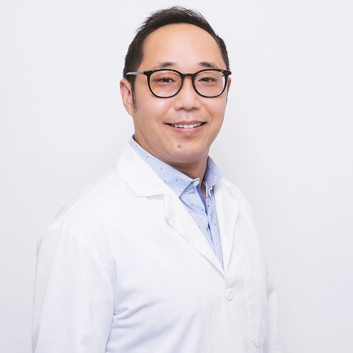 Professional photograph of Bill Harnold in lab coat in studio