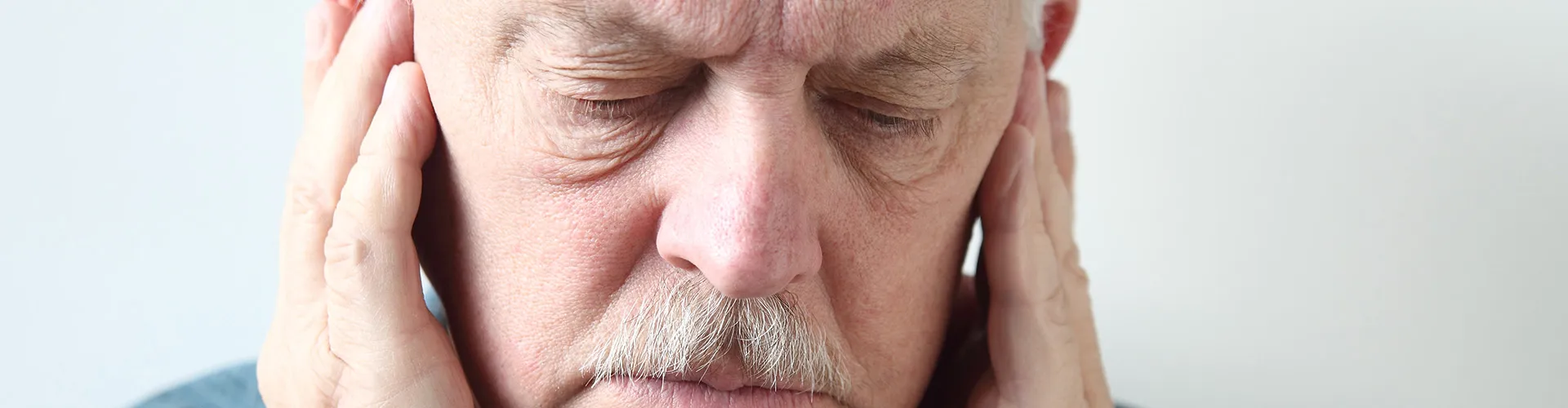 man holding his jaw joints