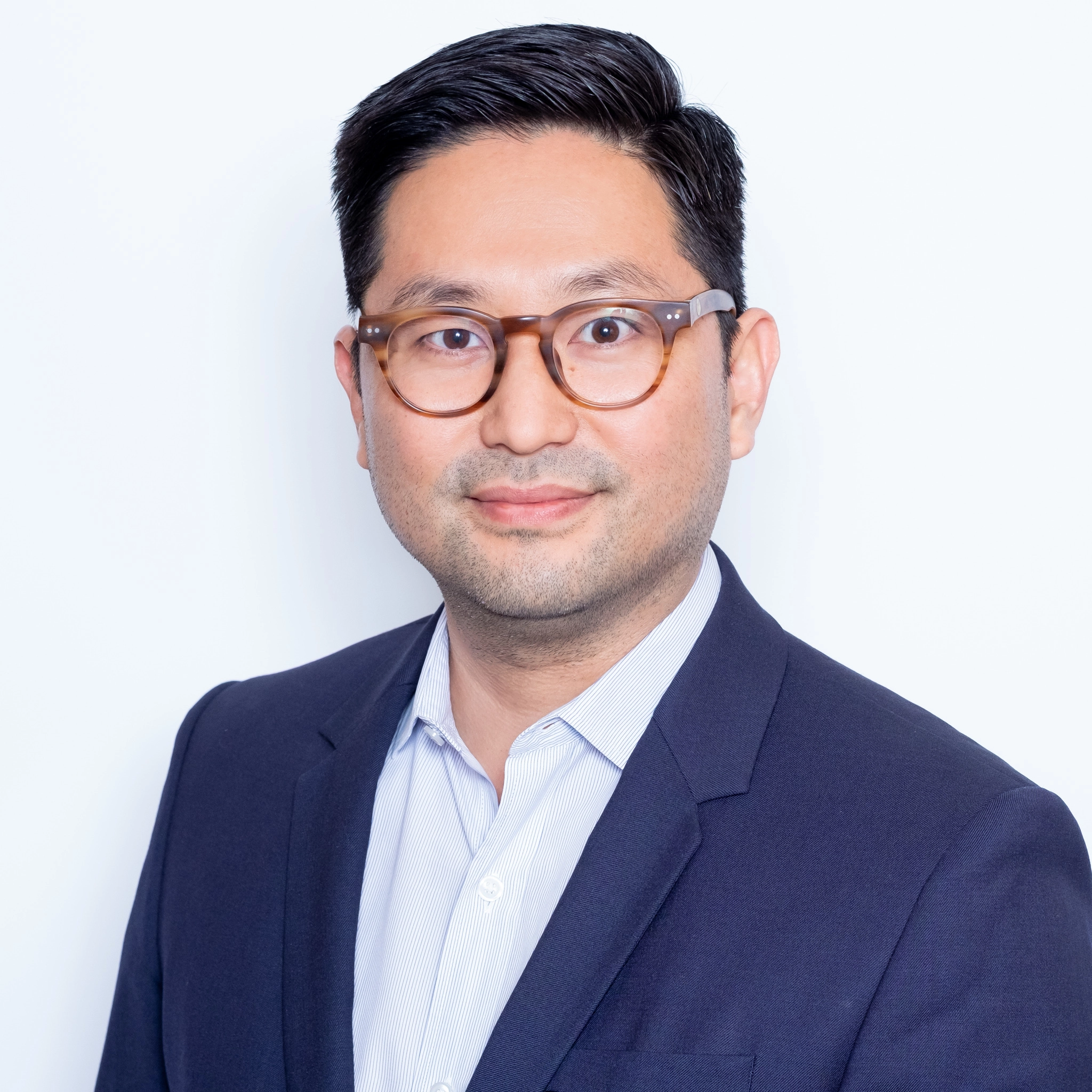 Coming soon message over blurred image of male professional.