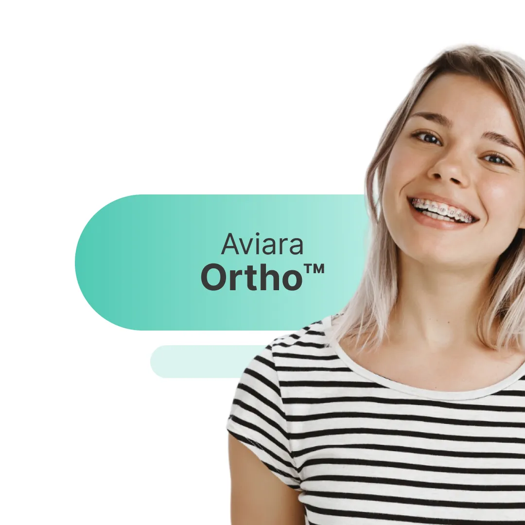 Model teeth with colorful braces; orthodontic treatment