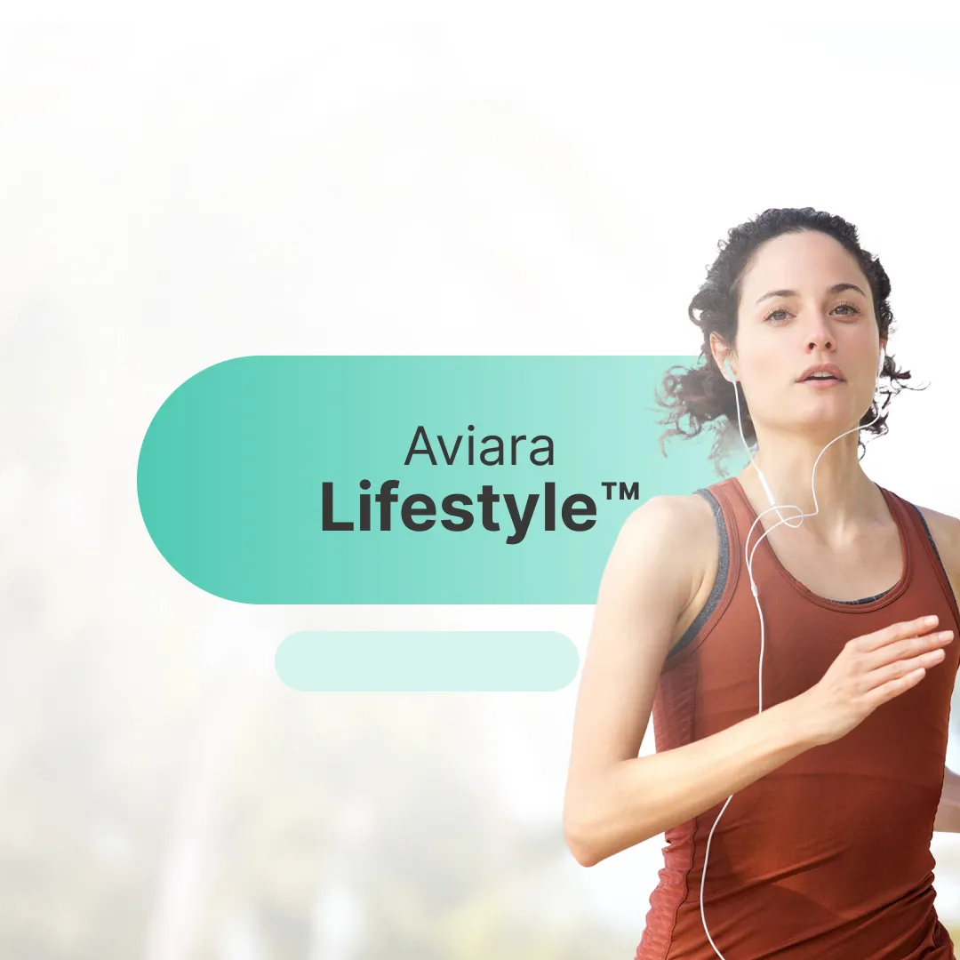 Woman jogging outdoors, focused on fitness and healthy lifestyle.